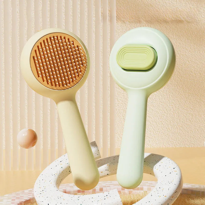 Cat grooming brush with stainless steel teeth and non-slip handle in green and yellow colour options