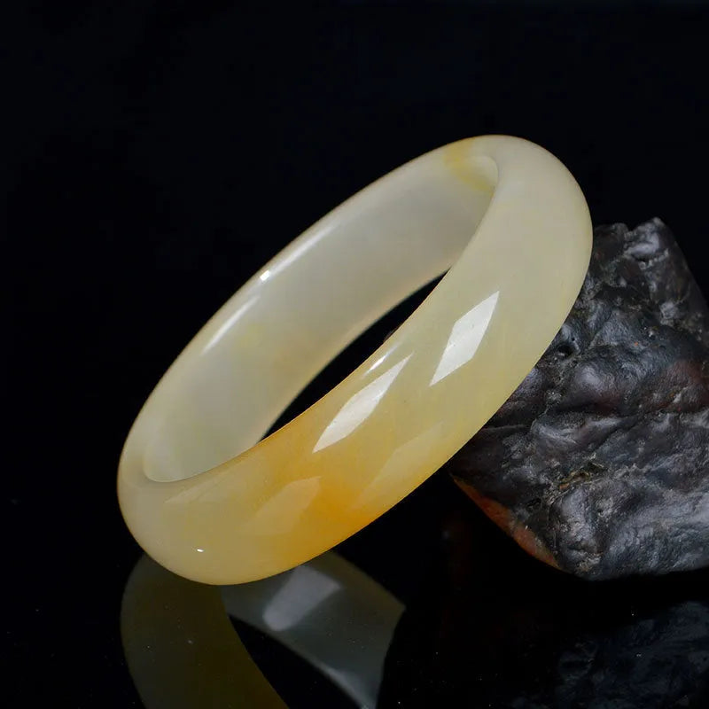 A polished light jade bracelet for women, shown in a Chinese style, with size options from 54mm to 62mm.