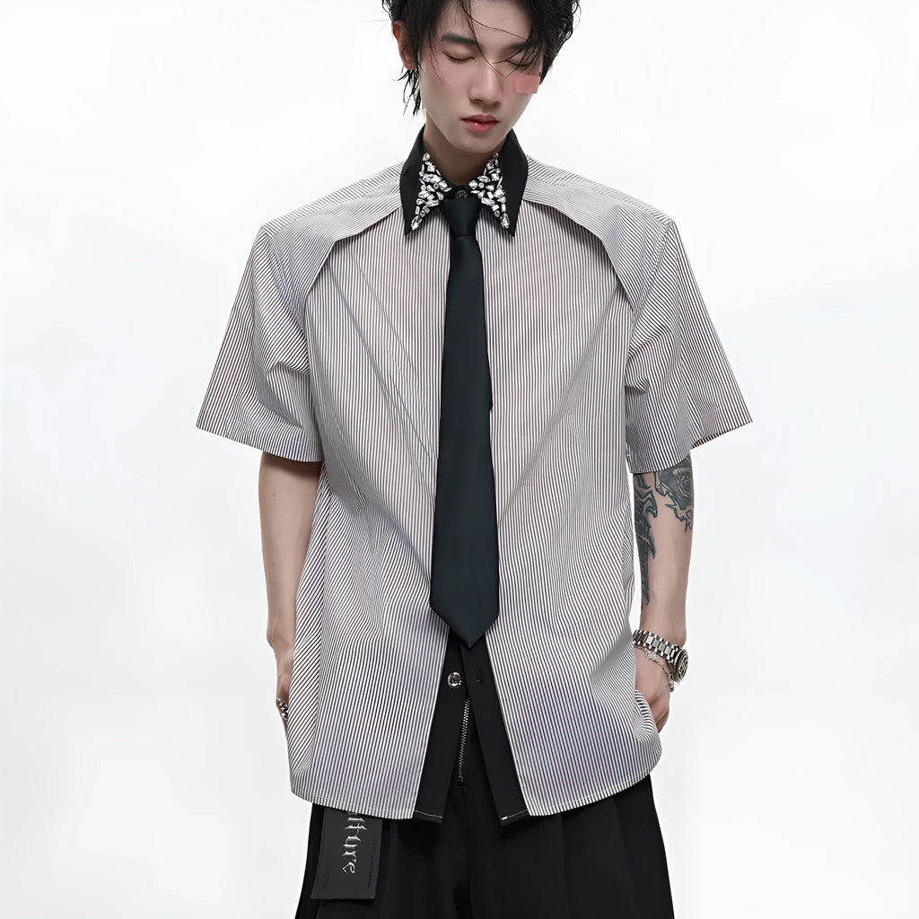 Man's blue patchwork striped shirt with a diamond tie front, quilted panels, and button decorations.