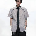 Man's blue patchwork striped shirt with a diamond tie front, quilted panels, and button decorations.