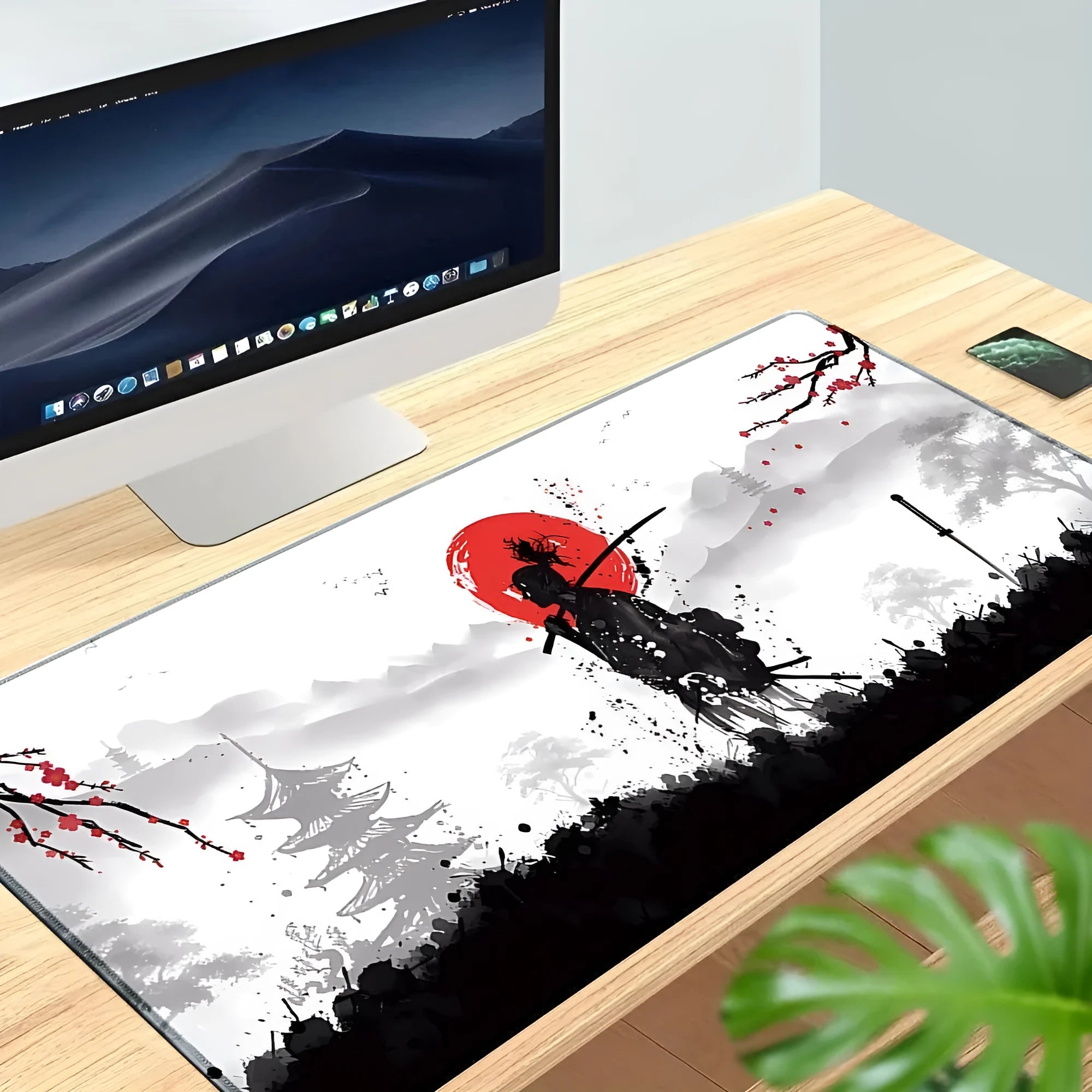 Japanese Samurai design gaming mouse pad on a desk, showing cloth surface and non-slip base.