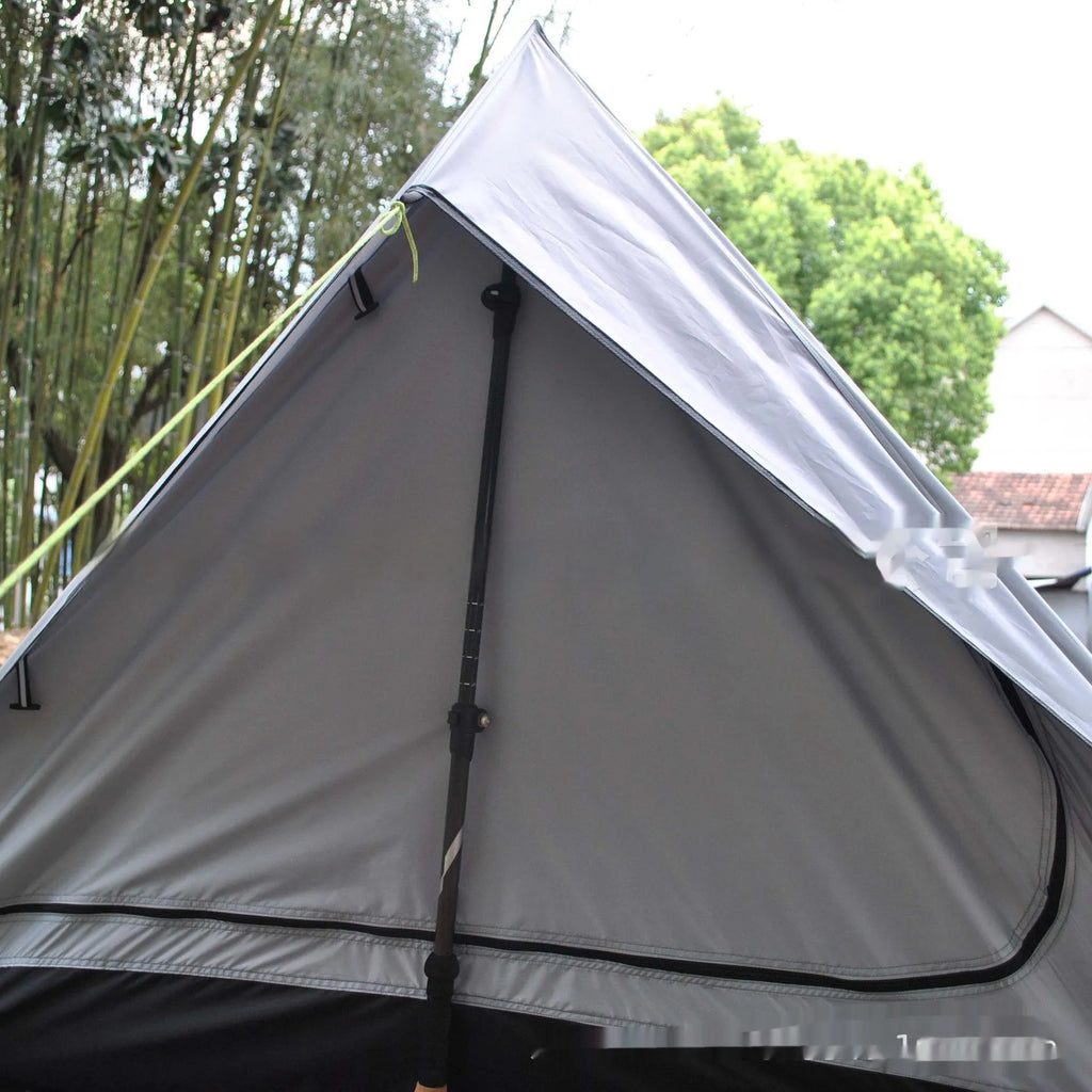 Brown or white A-line pole-free cabin tent for hiking, shown packed and pitched.