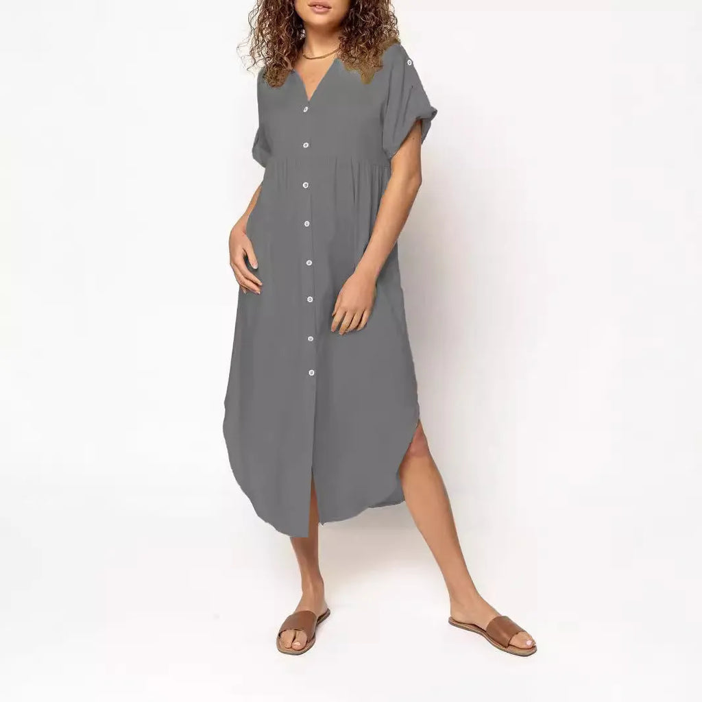 Loose-fitting casual solid colour button dress in a mid-length style on a hanger.