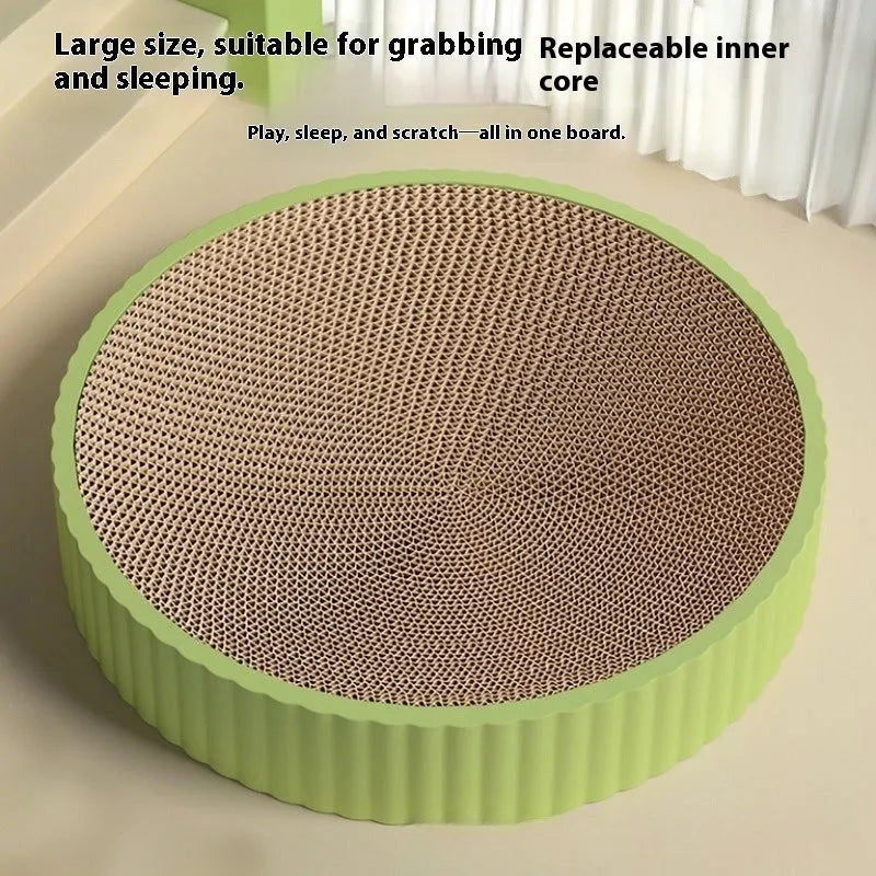 Green and white round cat scratching board with corrugated cardboard surface measuring 55cm across