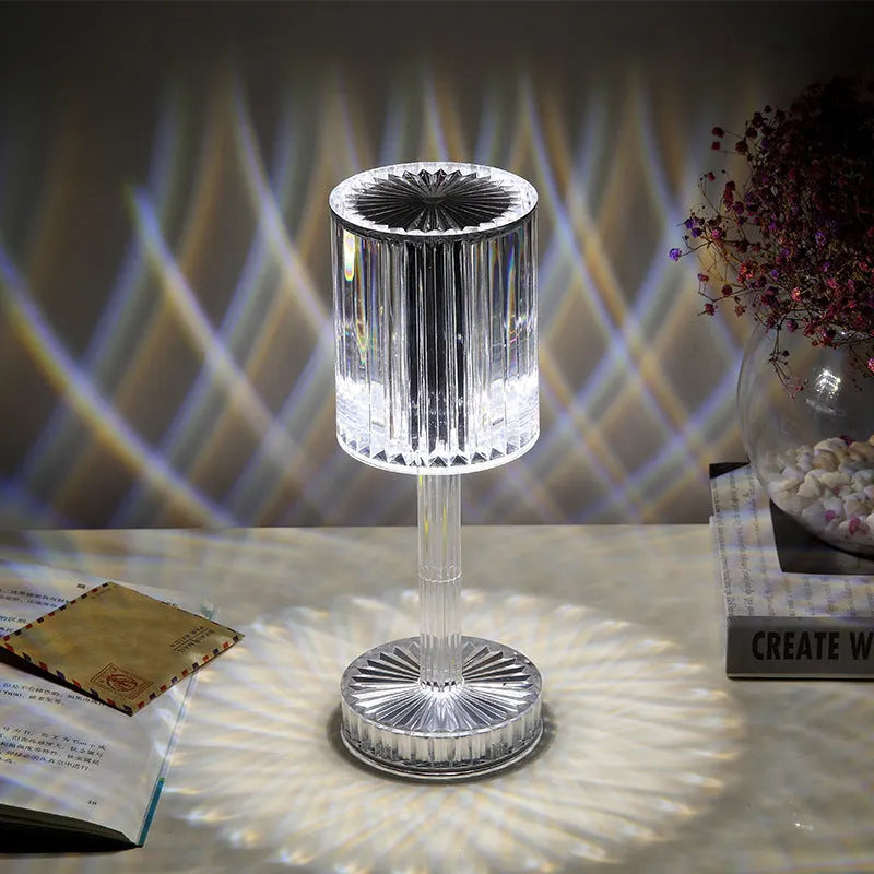 Amber K9 crystal table lamp with double-layered lampshade on a modern bedside table, warm LED light on medium brightness