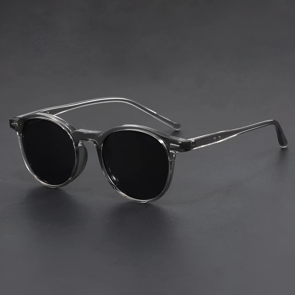 Round retro oval sunglasses with polarised lenses in Sand Black, Bright Black, Green, Gray, and Dry Tea frame colours.