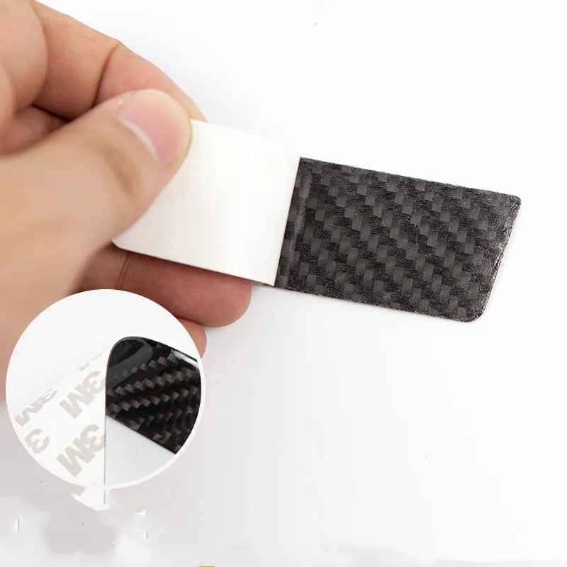 Set of four plain carbon fibre adhesive protection stickers for Tesla Model S door handles.