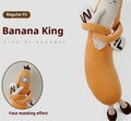 Banana King sleeping soft pillow toy in yellow plush with curved shape on a neutral background