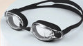 Black prescription swimming goggles for myopia with anti-fog lenses and a matching protective case.