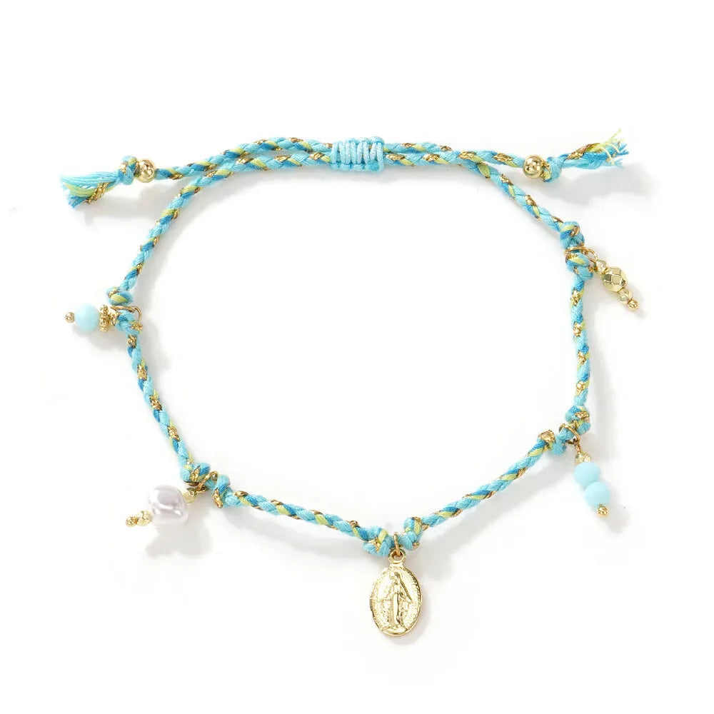 Close-up of a hand-woven colourful braided rope bracelet for women, showing textured ethnic style.