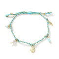 Close-up of a hand-woven colourful braided rope bracelet for women, showing textured ethnic style.