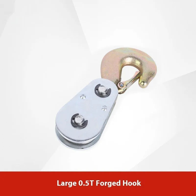 Red industrial steel lifting pulley with a safety latch on the hook.