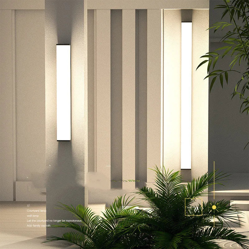 Outdoor wall light with stainless steel and PC construction measuring 60cm high with 125mm wall projection