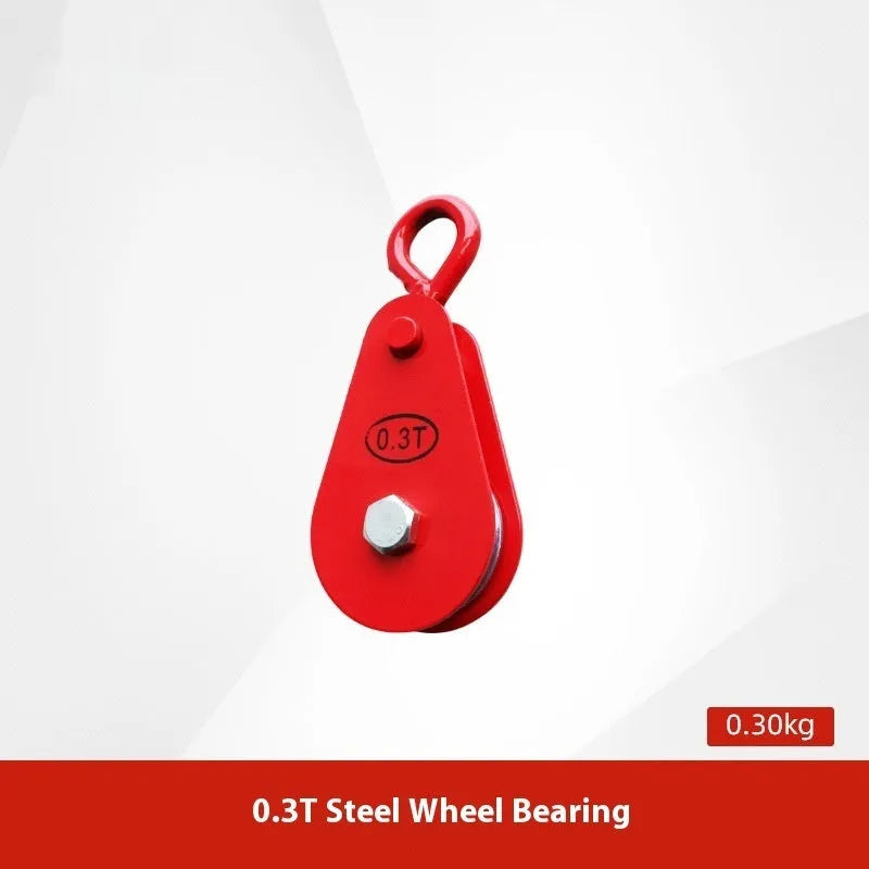 Red industrial steel lifting pulley with a safety latch on the hook.