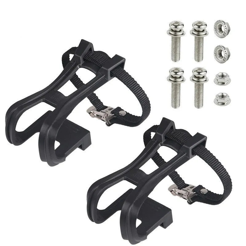 Pair of plastic spinning pedal foot holder covers with lashing straps and metal bolts on a black background