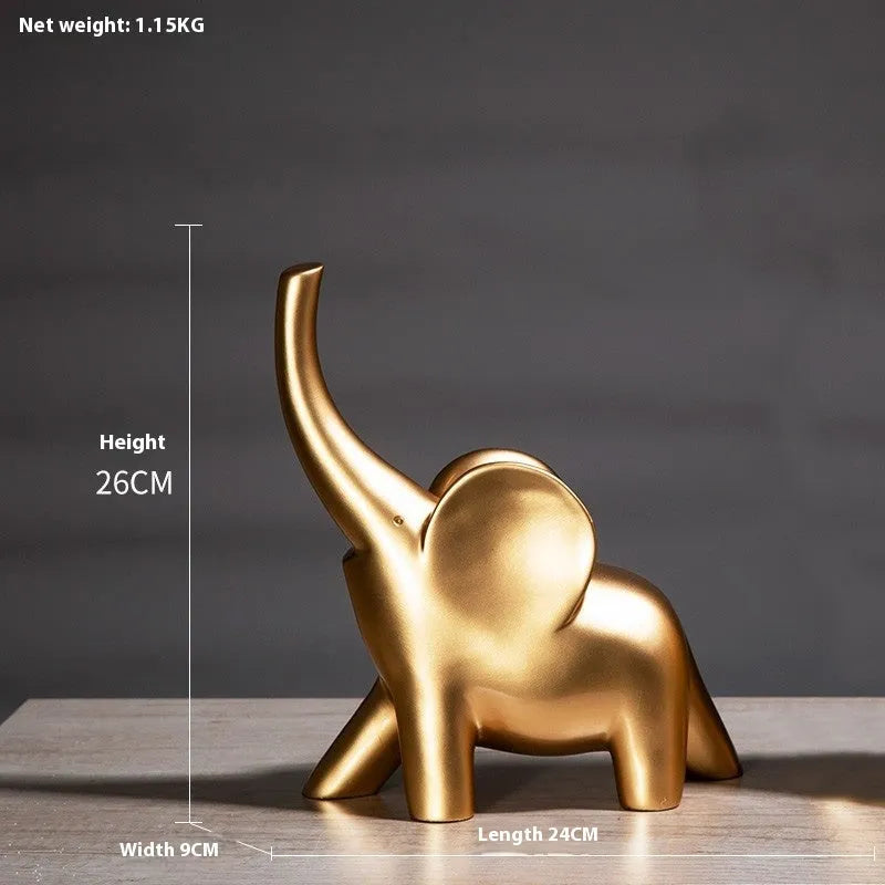 Modern minimalist solid resin elephant ornament in rose gold or white finish on a shelf.