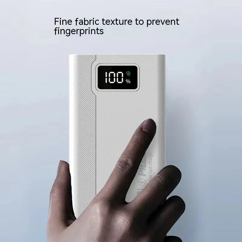 Large black and white plastic power bank showing front view with capacity options from 20000mAh to 50000mAh.