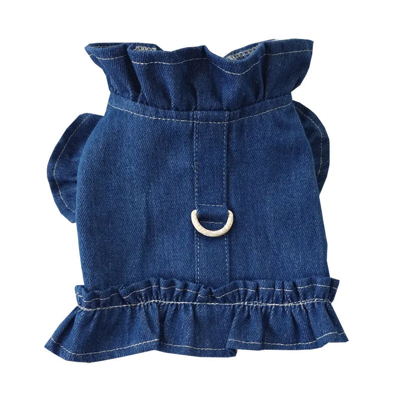 Blue denim dress for a dog or cat with ruffles and a metal leash hook on the chest.