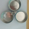 Mini stainless steel egg steamer showing both round and heart-shaped design options on a kitchen counter.