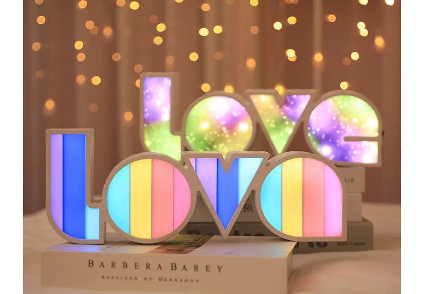 LED decorative light with rainbow-coloured LOVE word on plastic shade