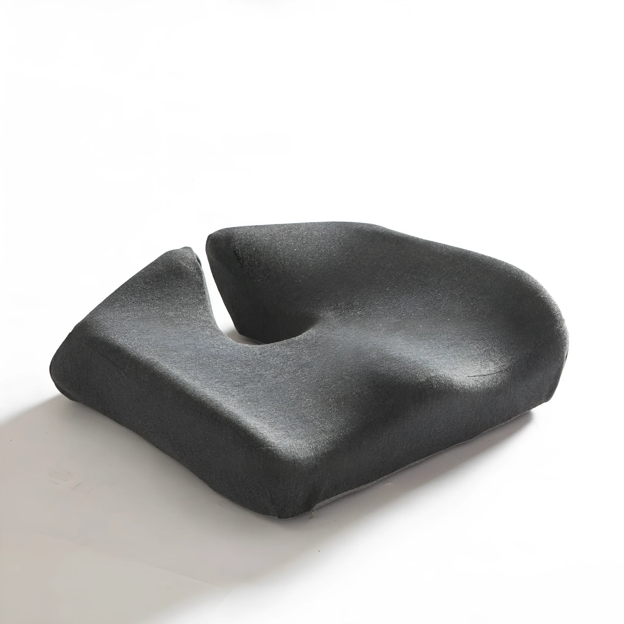 Black memory foam office chair cushion with a solid colour polyester cover, shown on a chair seat.