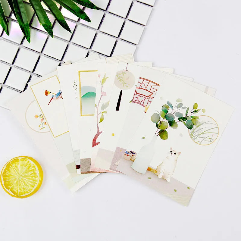 Set of nine Japanese style postcards showing various designs including ink painting and cat illustrations.