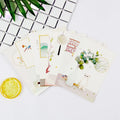 Set of nine Japanese style postcards showing various designs including ink painting and cat illustrations.