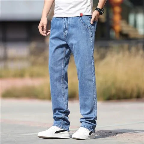 Men's straight-leg smoky gray jeans with low-rise waist and zip fly.