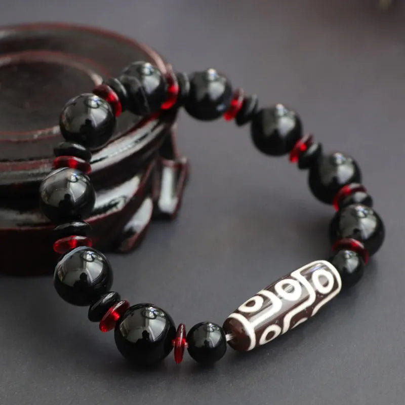 Black agate Dzi bead bracelet with 11mm geometric beads and hand-woven construction