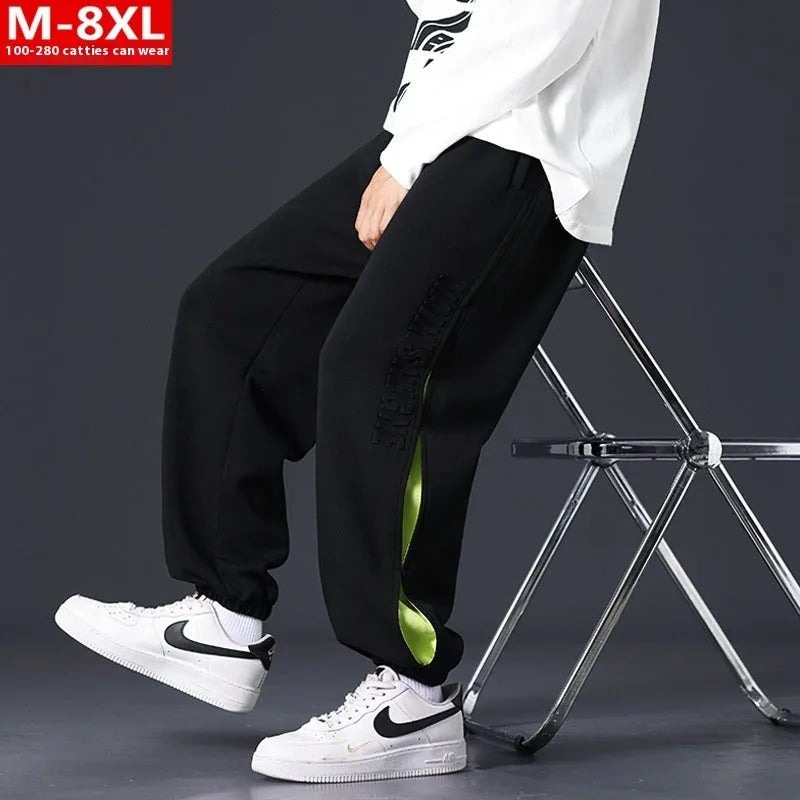 Men's loose fit cotton casual trousers with stitching print design and banded ankle cuffs.