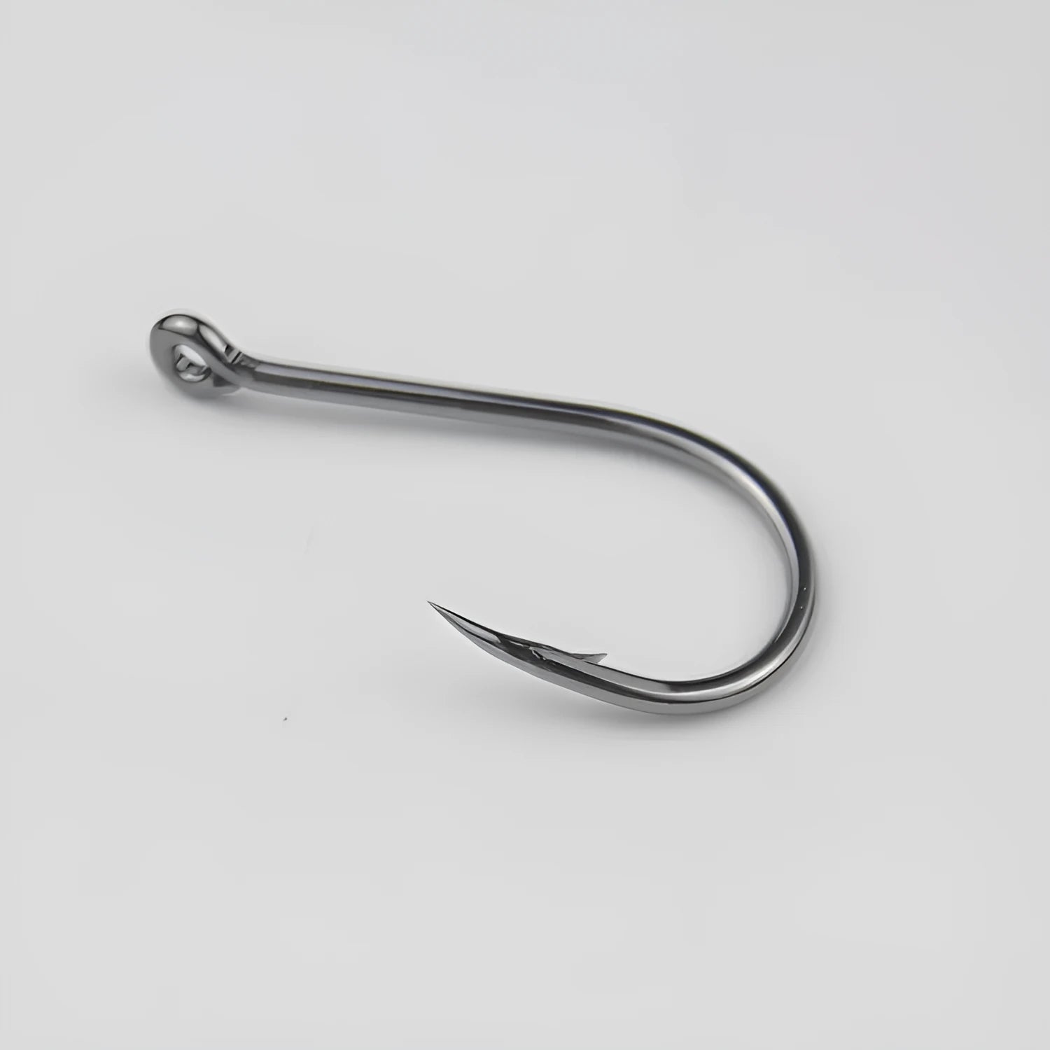Bulk pack of barbed alloy carbon steel fishing hooks with hole rings for sea fishing