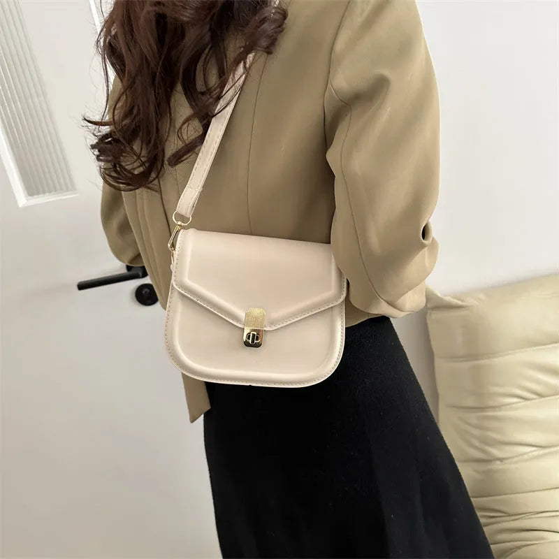 Niche texture shoulder messenger bag in soft PU leather with clamshell opening and horizontal square shape