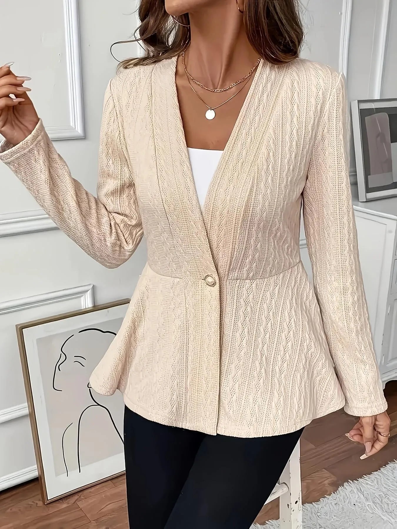 Women's fitted knitted cardigan in apricot colour with one-button fastening and jacquard pattern