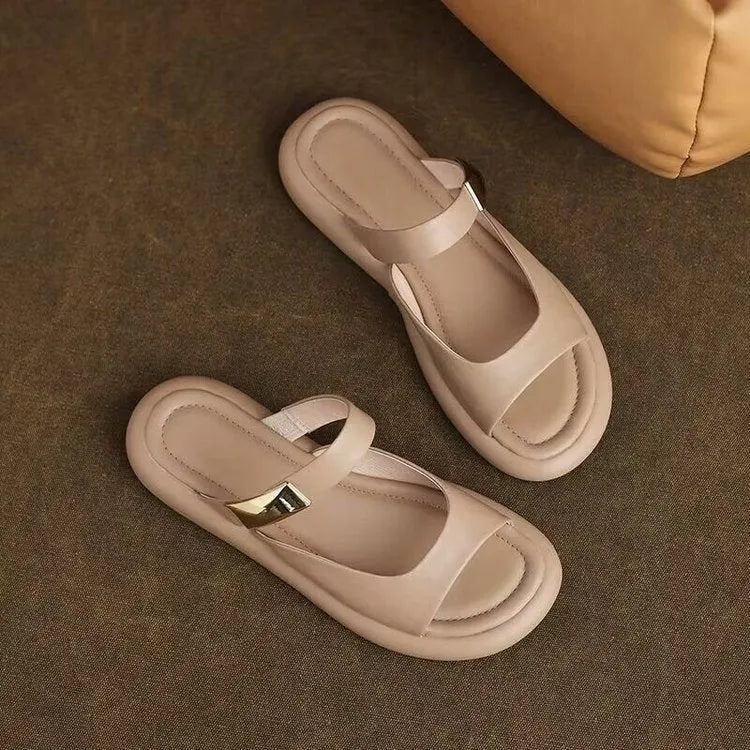 Women's apricot and white peep toe flat platform sandals with a rubber sole.