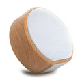 White wood grain Bluetooth speaker on a desk