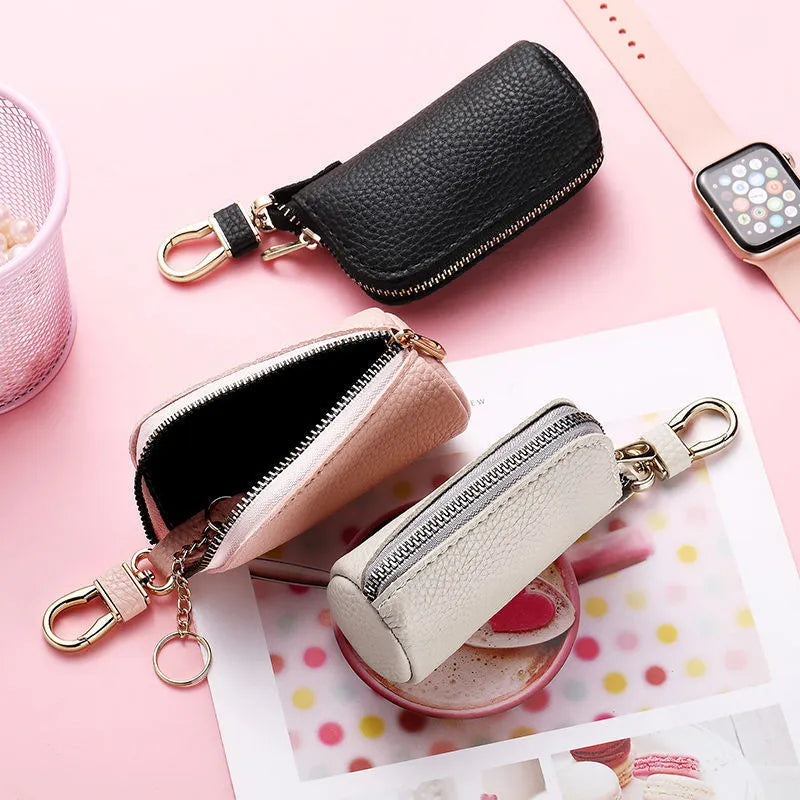 Minimalist black waterproof PU leather zip key pouch for car keys on table