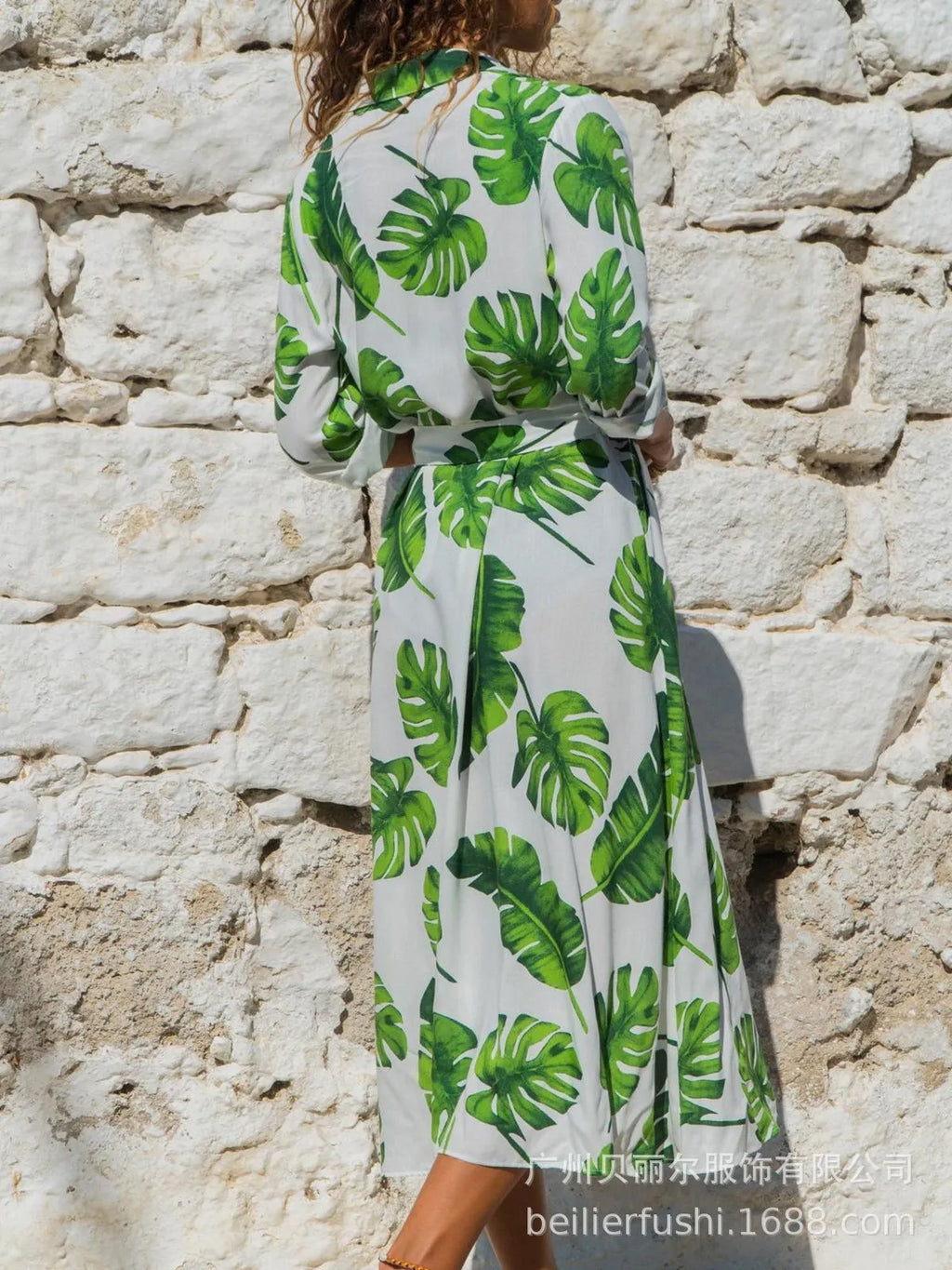 Women's printed chiffon V-neck dress with A-line skirt in black blue colour.