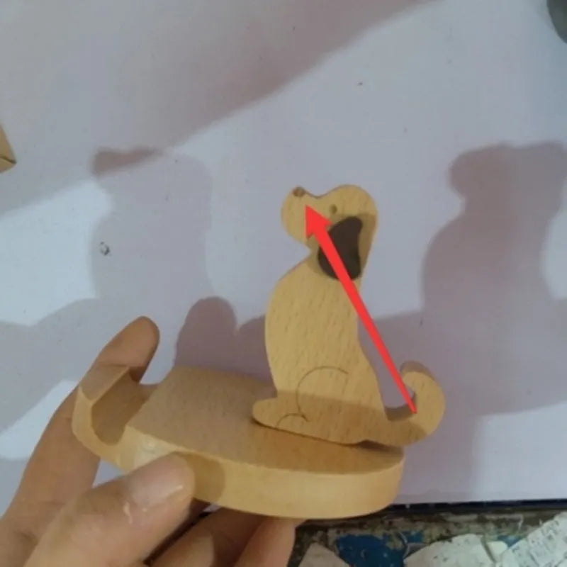 Decorative resin mobile phone stand in a choice of styles including animal figures and wood-effect designs.