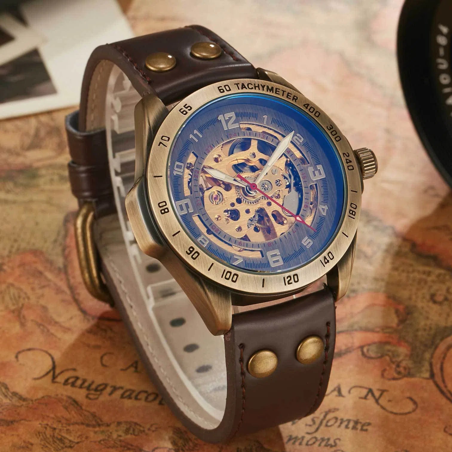 Men's automatic mechanical watch with hollowed-out round dial, 42mm alloy case, genuine leather strap, and transparent case back
