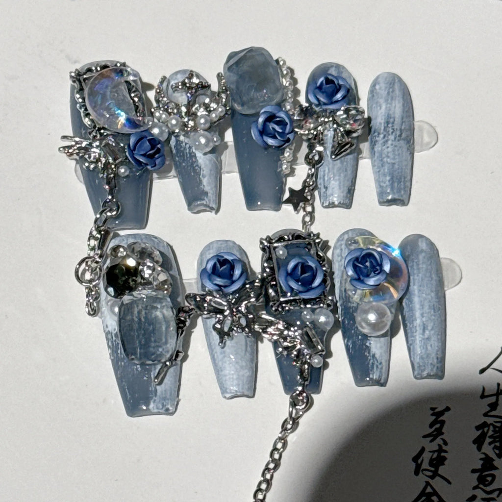 Heavy industry blue false nails with ornate rose and tulip pattern, shown in sizes XS S M L.