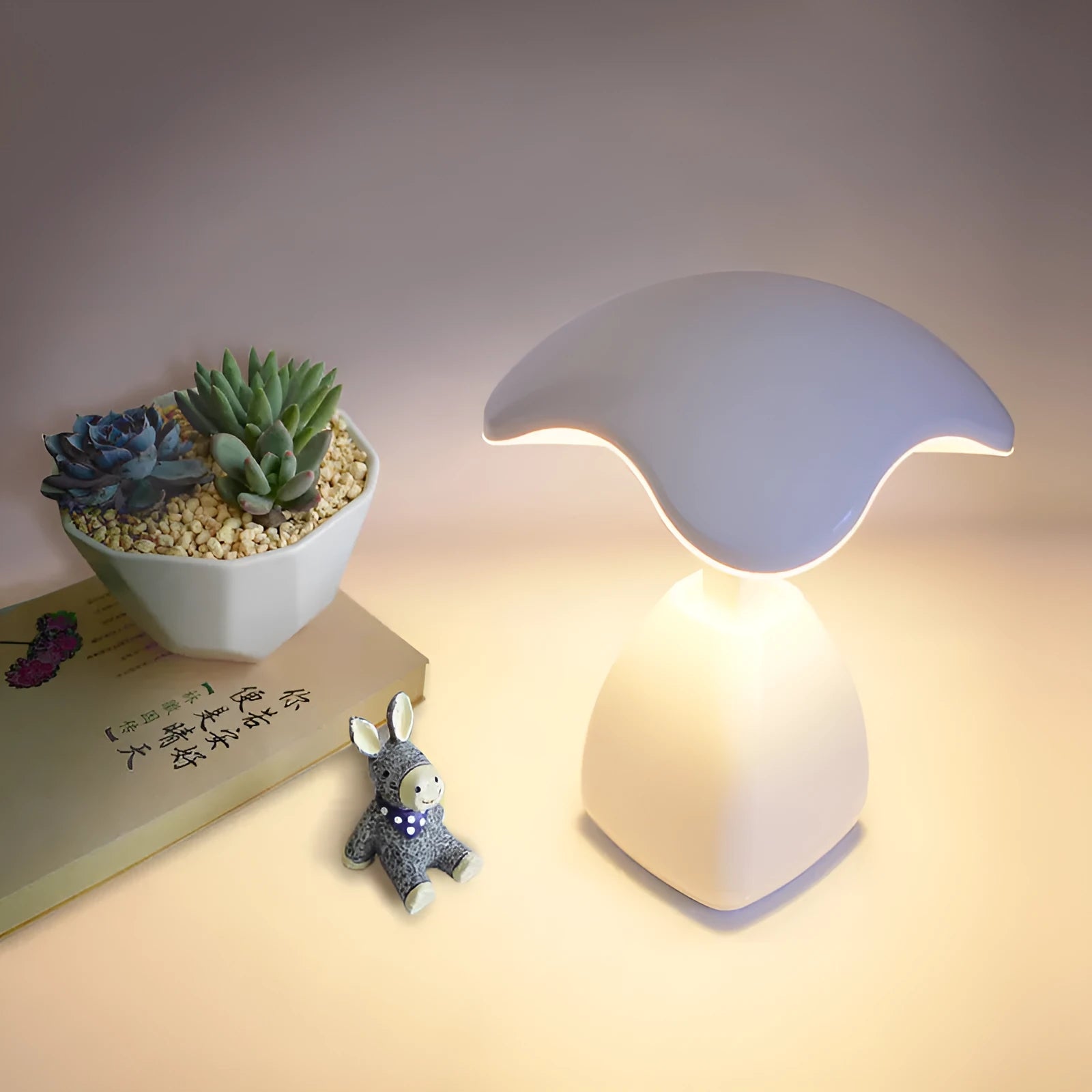 White modern LED desk lamp with a touch-sensitive base and plastic shade.