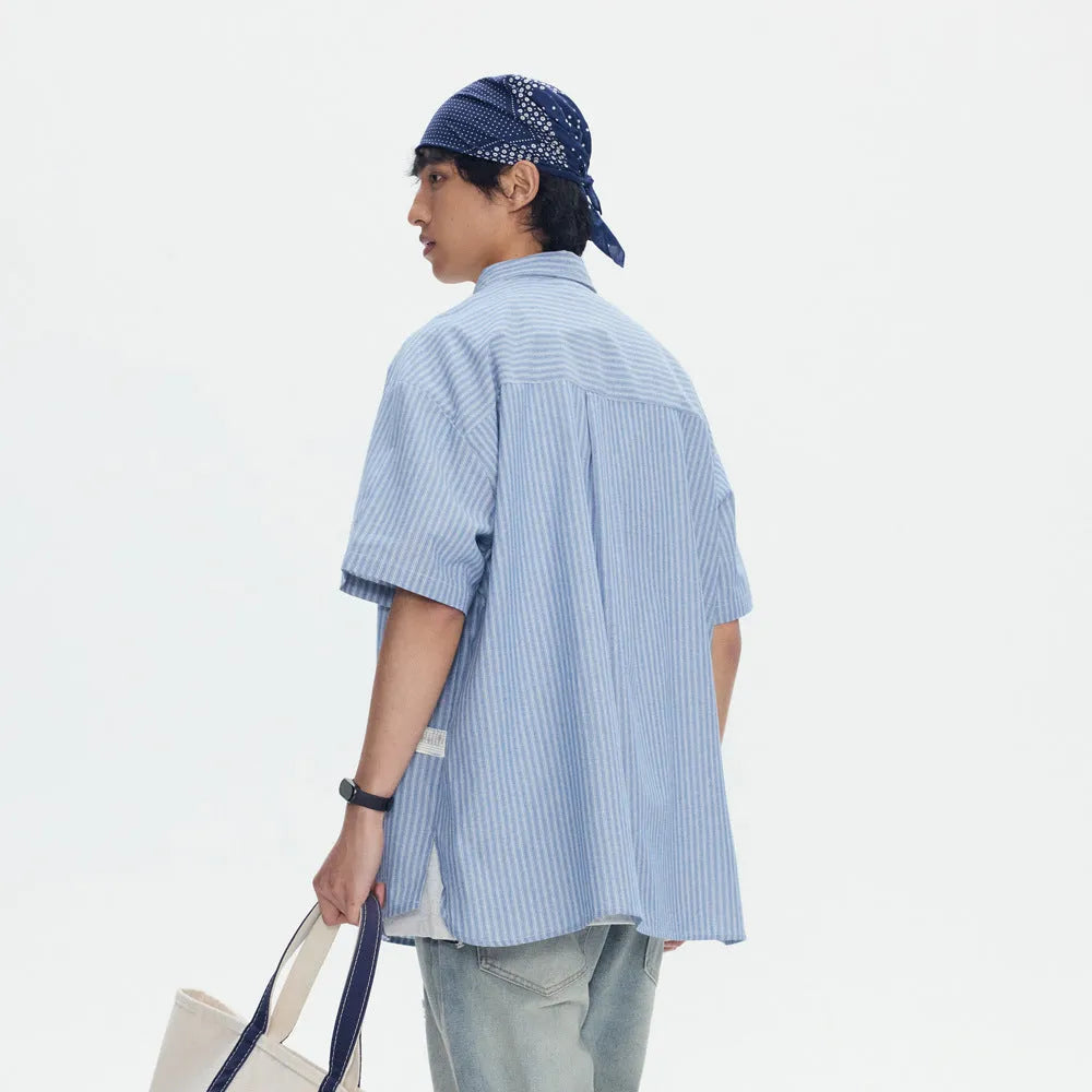 Blue striped unisex short-sleeve overall shirt in a loose cardigan style