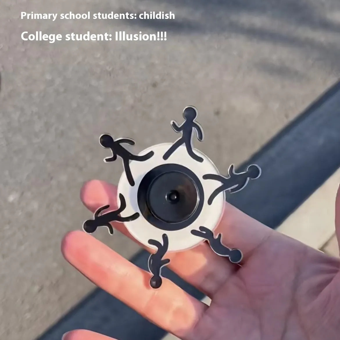 Colourful stickman running dynamic fingertip gyro on a white surface, spinning motion visible