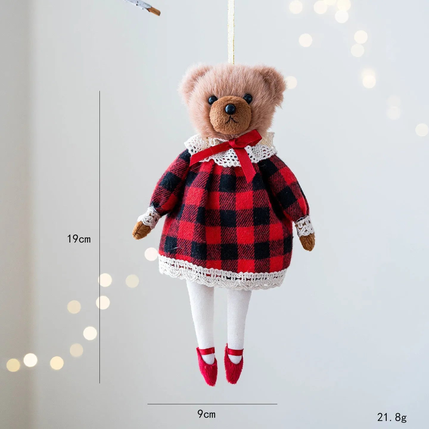 Pair of plush bear dolls wearing red and black plaid cotton clothing, cartoon style.