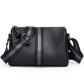 Black genuine leather crossbody bag with one-shoulder strap showing interior polyester lining