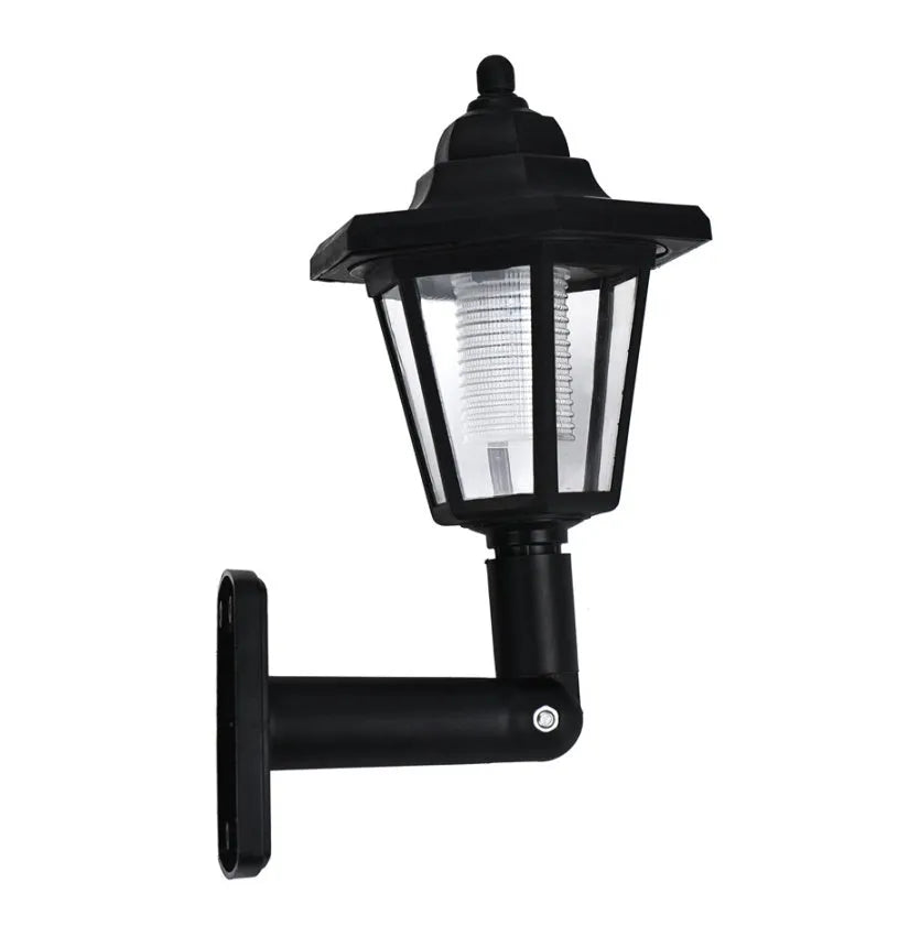 Black hexagonal solar-powered outdoor wall light with a visible solar panel and LED.