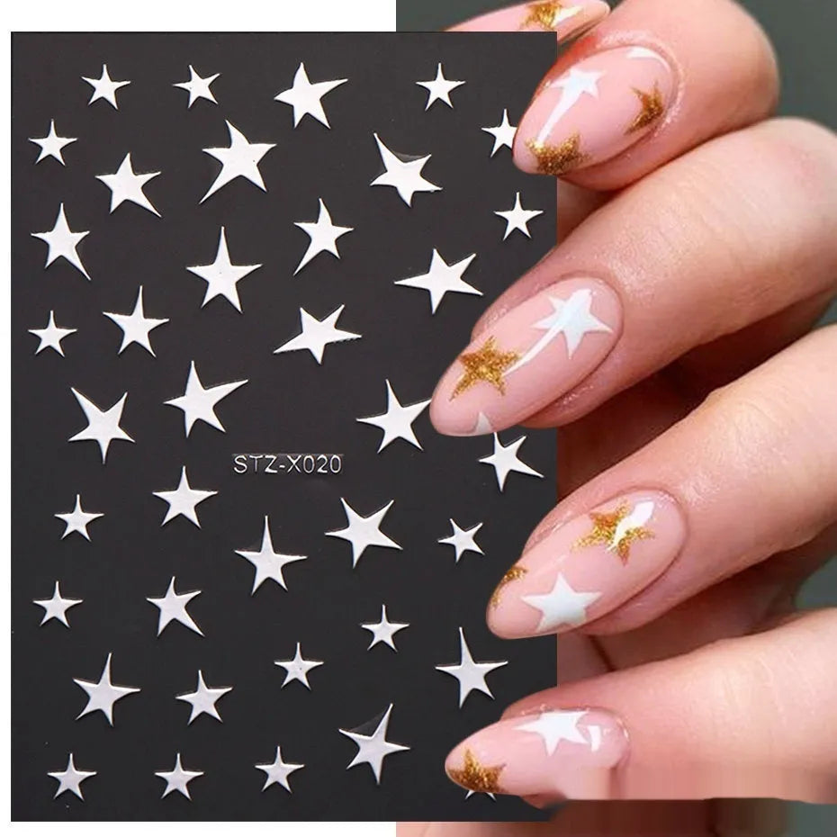Pack of black and silver strip nail art stickers with cartoon and love pattern designs.