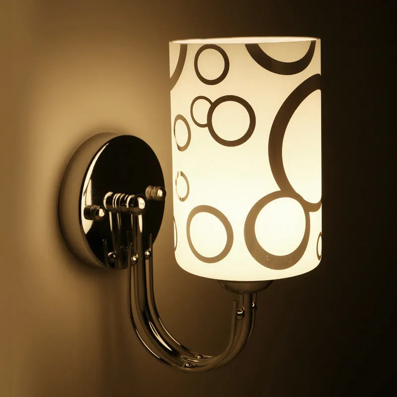 Modern petal designer wall light with acrylic shade and E27 socket, single head version, white finish on a wall