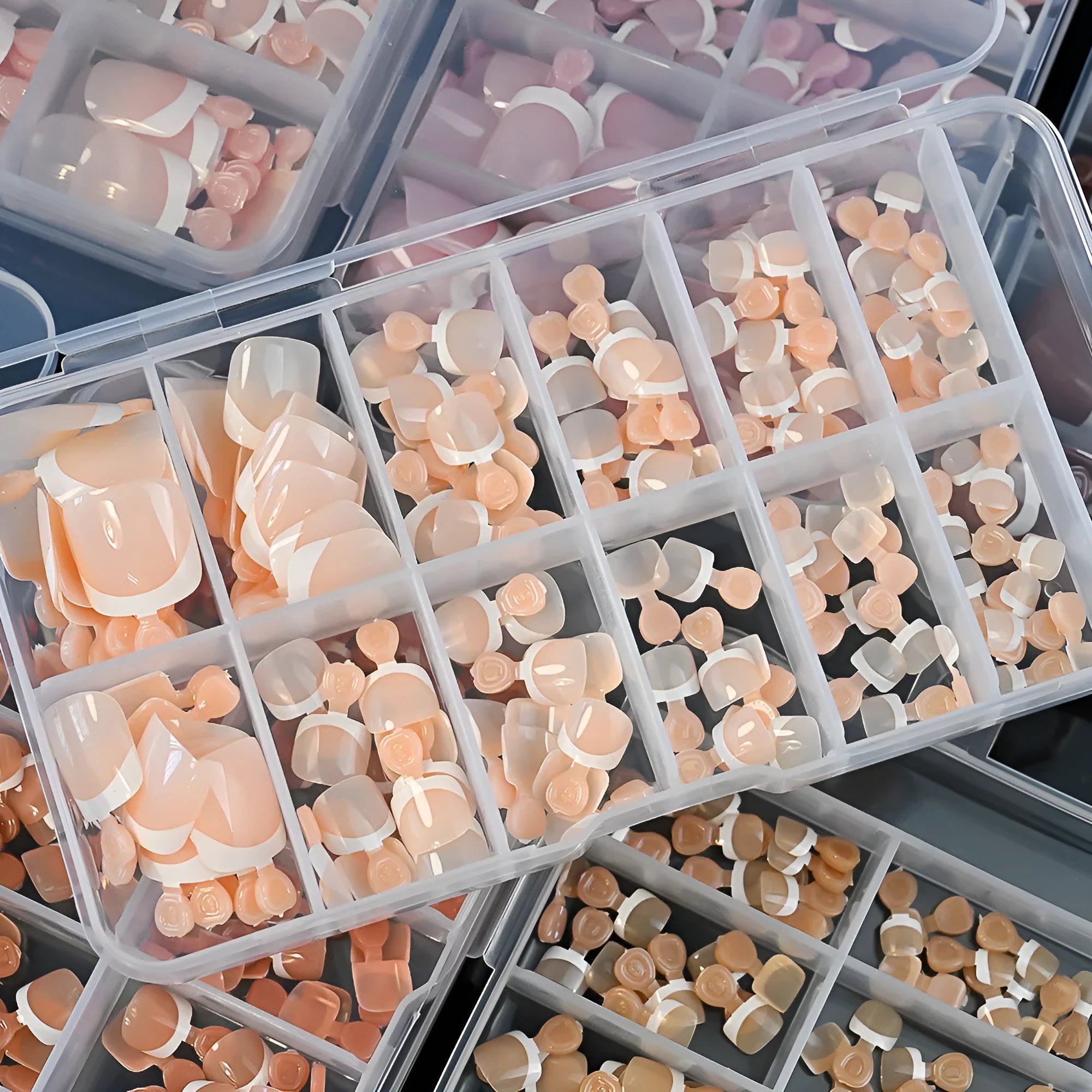 120 piece box of nude square artificial nail tips with French white edges in assorted shades