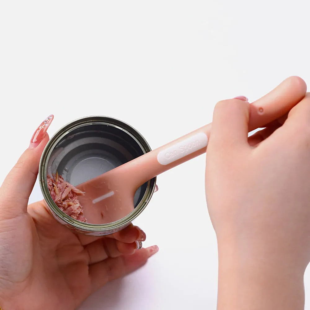 Green long-handled pet feeding spoon for scraping canned cat or dog food
